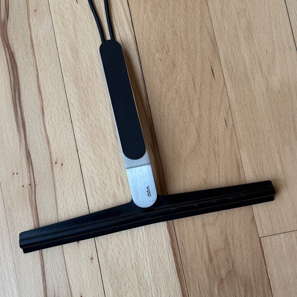 Vipp black and silver bathroom or surface wiper